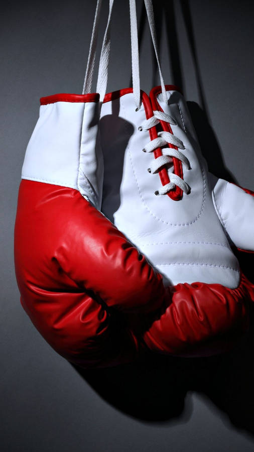 Hanging White Red Boxing Gloves Wallpaper