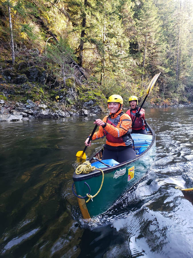 Happy Men Canoeing Wallpaper