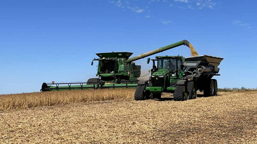 Harvesting_ Machinery_in_ Action Wallpaper