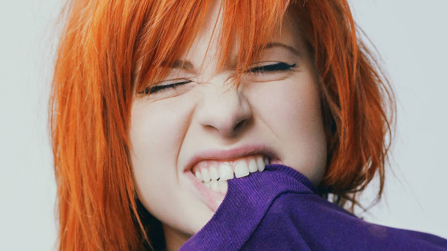 Hayley Williams Biting Purple Shirt Wallpaper