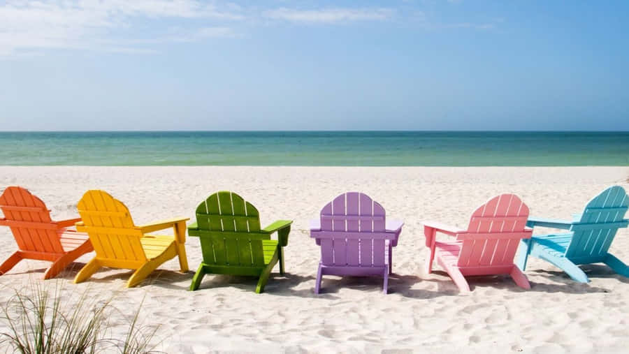 Hd Beach With Rainbow Chairs Wallpaper