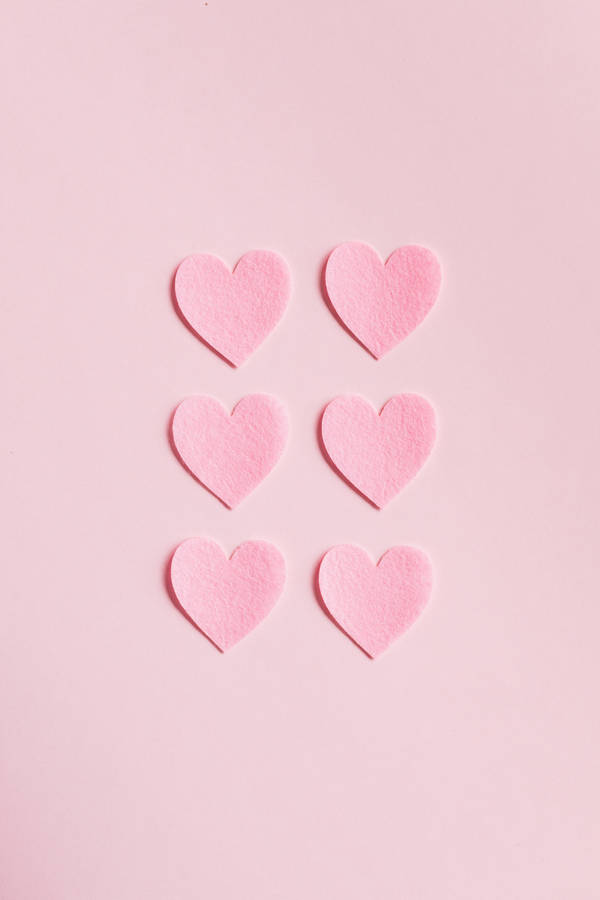 Hearts On Pink Background Wallpaper