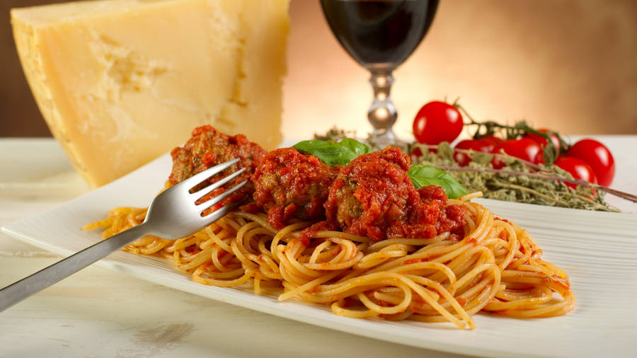 Hearty Italian Dinner: Pasta With Meatballs Wallpaper