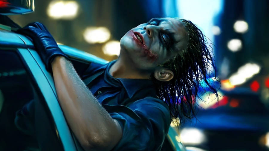 Heath Ledger Joker In Police Car Wallpaper