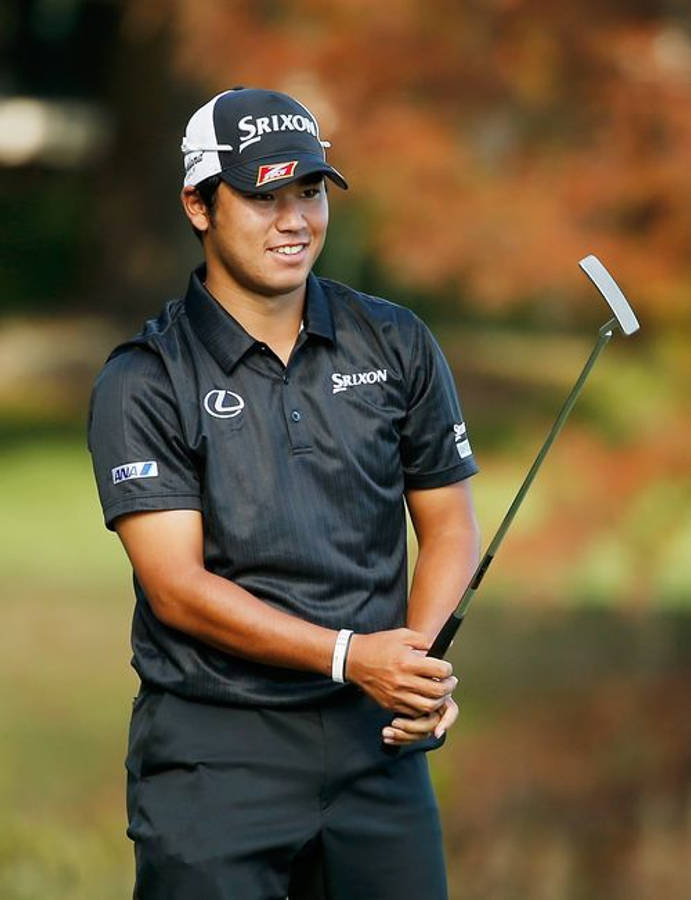 Hideki Matsuyama Grasping Golf Putter Wallpaper