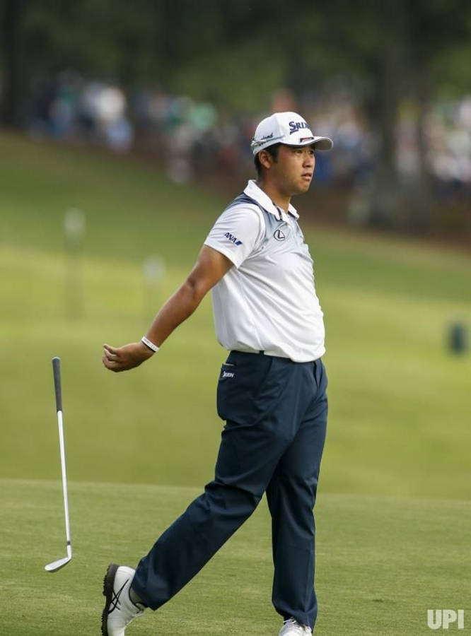 Hideki Matsuyama Letting Go Of Golf Club Wallpaper