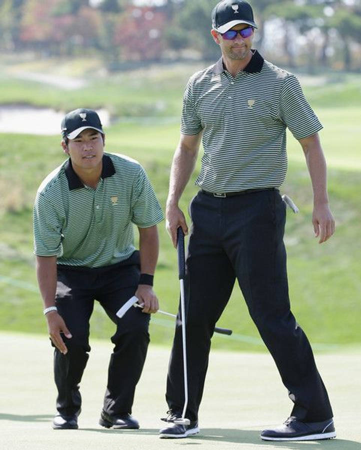 Hideki Matsuyama With Fellow Golfer Wallpaper