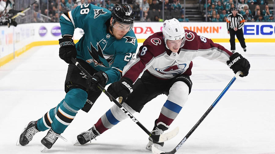 High-performance Game Moment Between Nhl Stars; Cale Makar Goes Up Against Timo Meier. Wallpaper