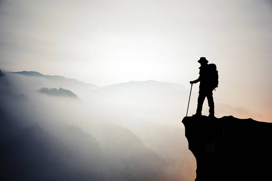 Hiker On Mountain Enjoying Life Wallpaper