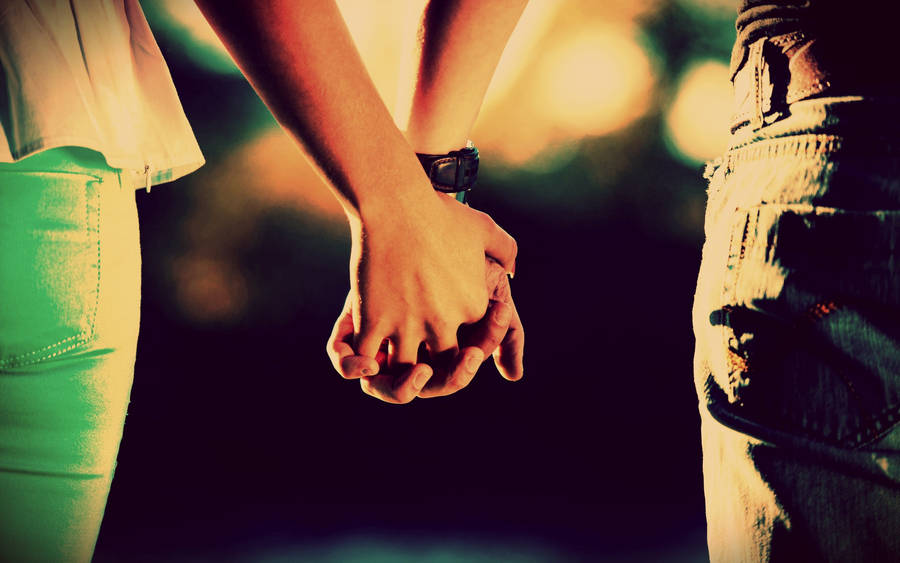 Holding Hands Back Angle Shot In Bokeh Effect Wallpaper