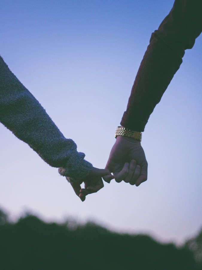 Holding Hands In Pinky Promise Wallpaper