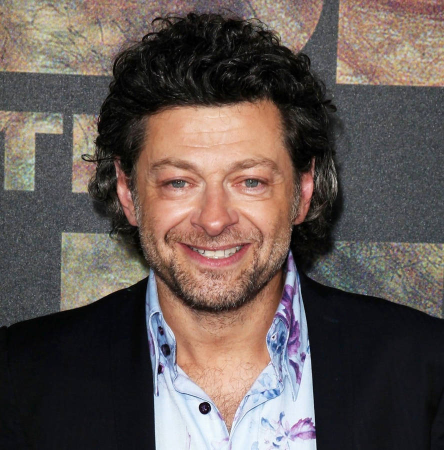 Hollywood Actor Andy Serkis With Warm And Wide Smile Wallpaper