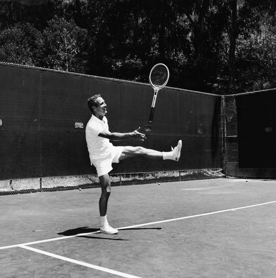 Hollywood Legend Paul Newman Enjoying A Game Of Tennis Wallpaper