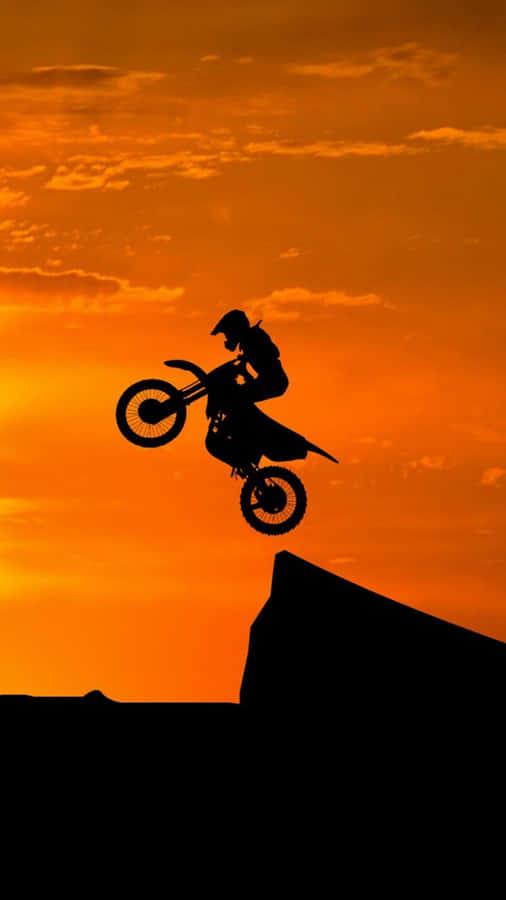 Honda Dirt Bike Jumping Off Cliff Wallpaper