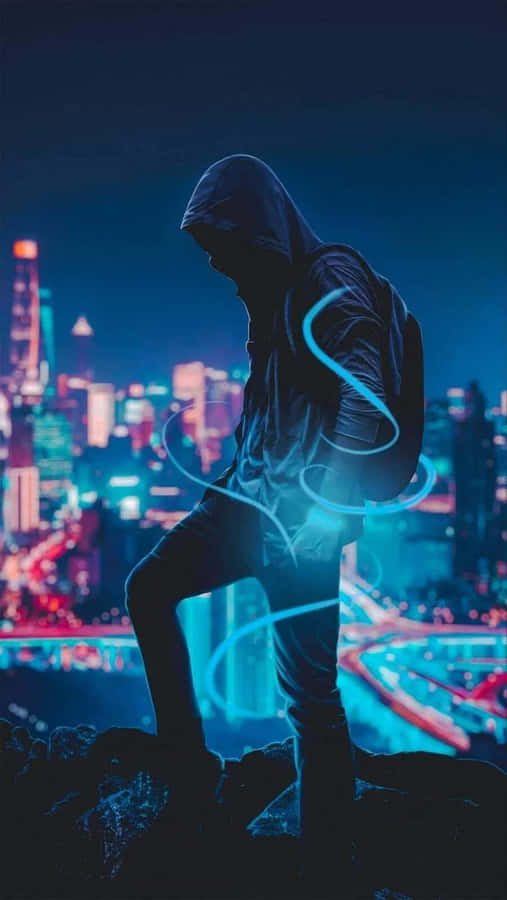 Hooded_ Figure_ Overlooking_ City_ Night Wallpaper