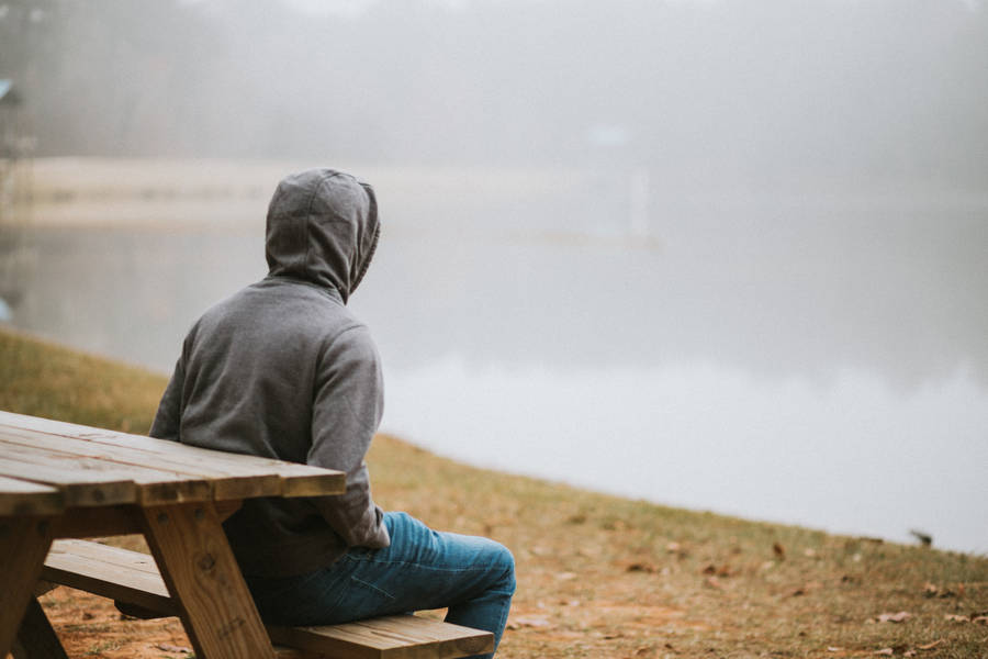 Hoodie Man On Bench Wallpaper