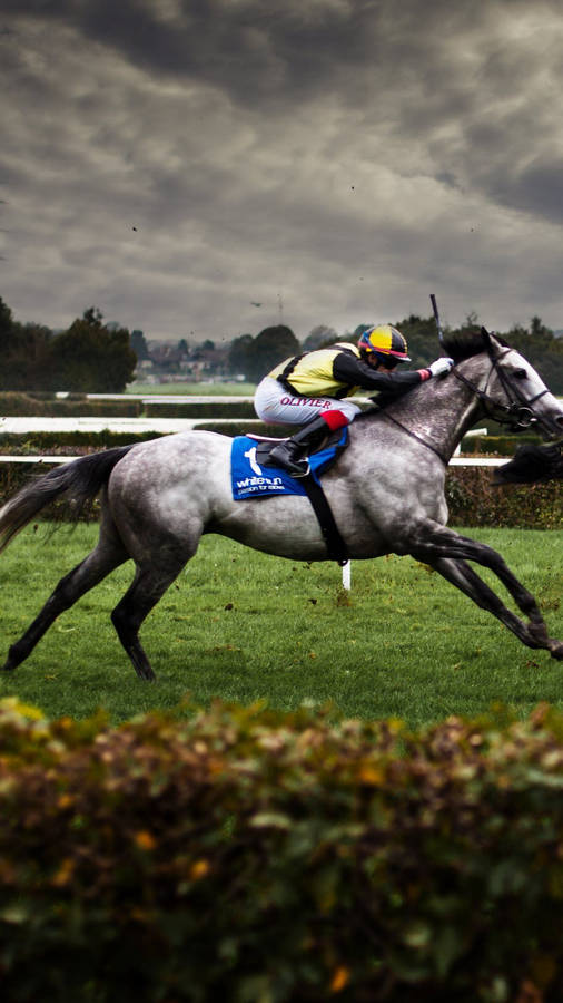 Horse Racing With Dark Sky View Wallpaper