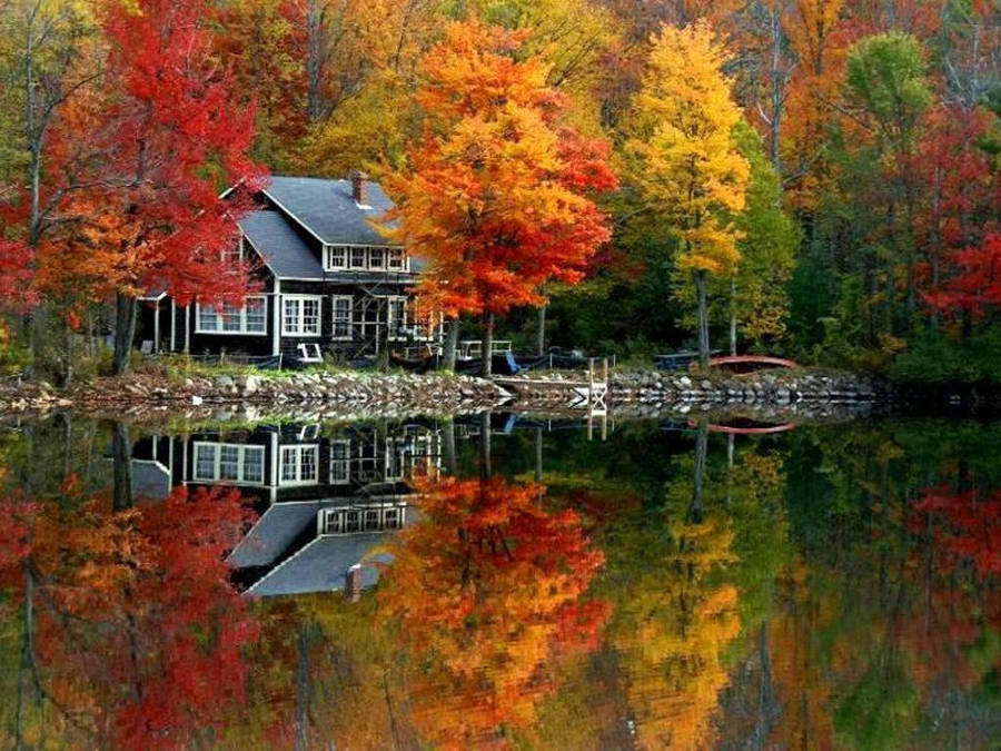 House On The Riverside During Fall Wallpaper