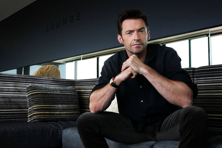 Hugh Jackman On Couch Wallpaper