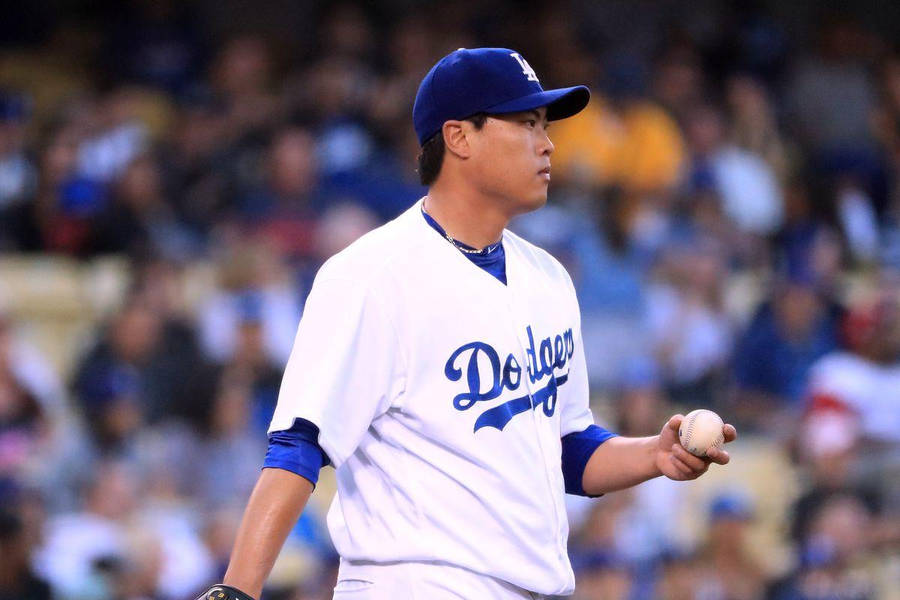 Hyun Jin Ryu Confidently Holding A Baseball In One Hand Wallpaper