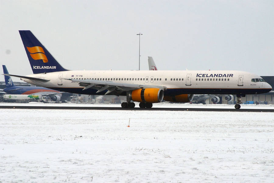 Icelandair Airplane On Snowy Runway Wallpaper