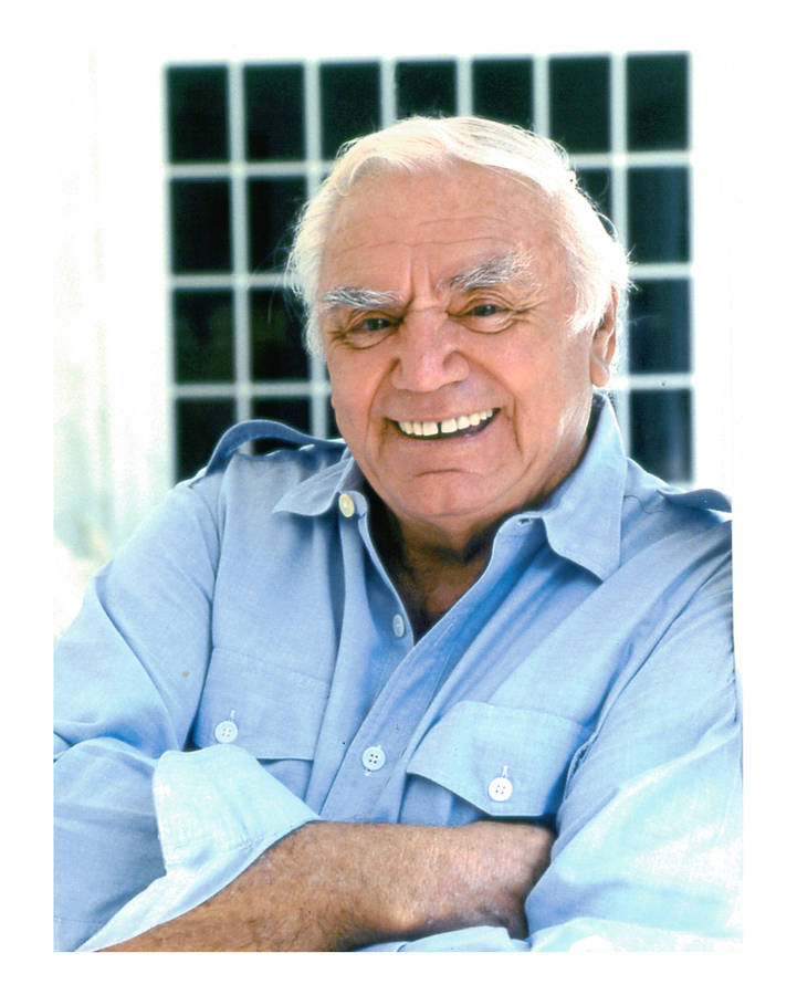 Iconic Actor Ernest Borgnine In A Blue Shirt. Wallpaper