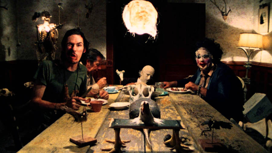 Iconic Horror Scene From Texas Chainsaw Massacre Wallpaper