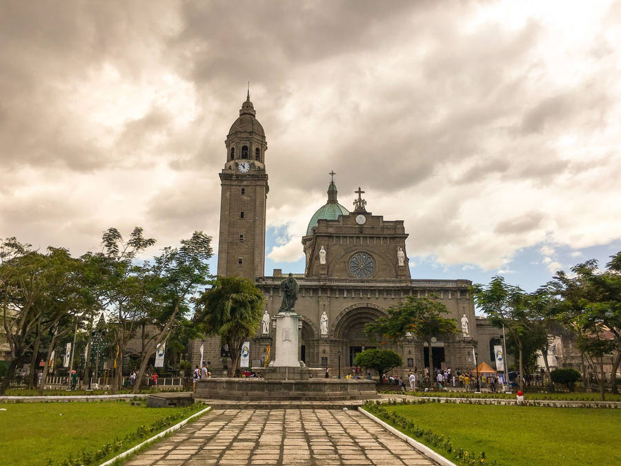 Illuminated Manila Cathedral At Evening Wallpaper