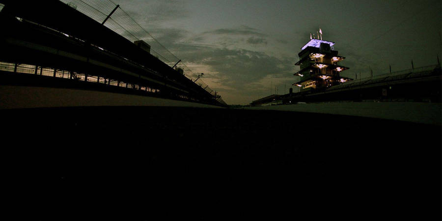 Illuminated Night At The Indianapolis 500 Motor Speedway Wallpaper