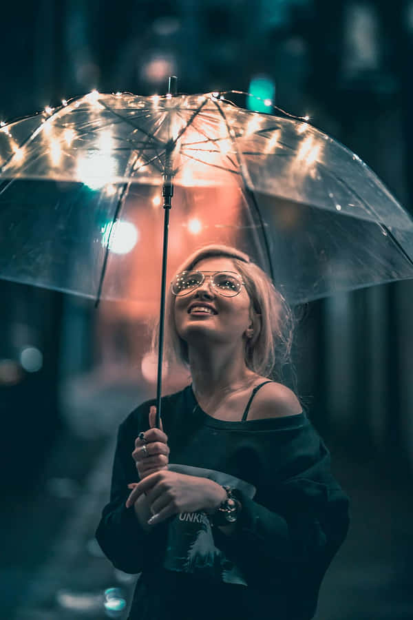 Illuminated Umbrella Nighttime Portrait Wallpaper