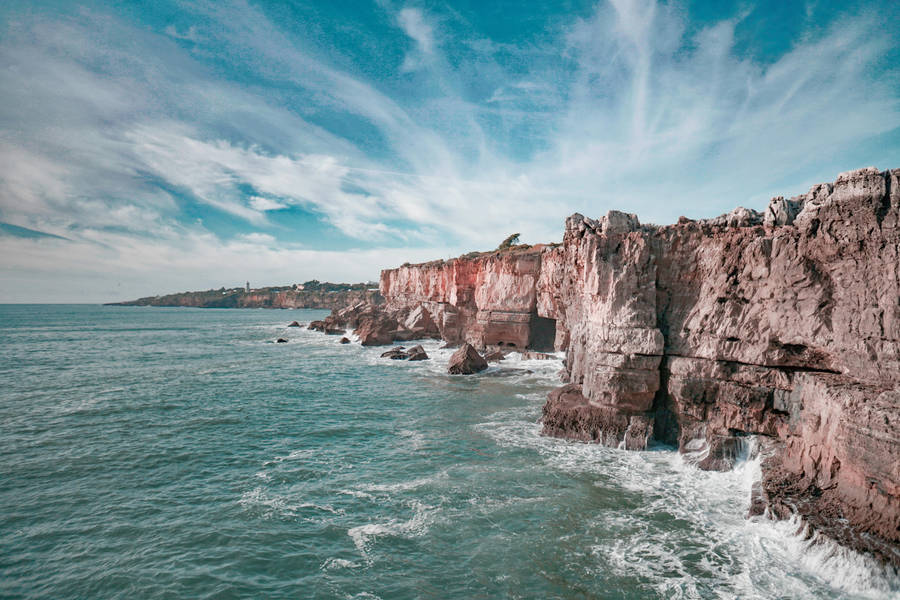 Image A Beautiful View Of The Ocean From A Beach In Portugal Wallpaper