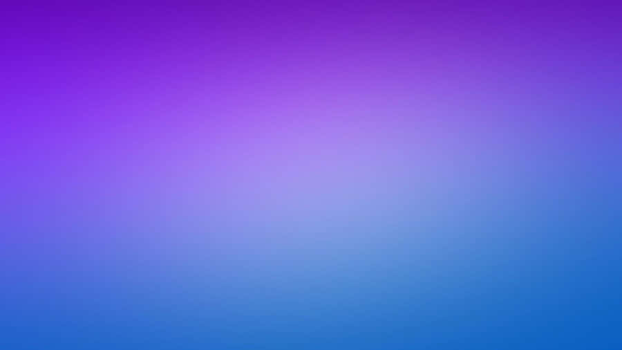 Image A Purple Laptop On A Marble Table Wallpaper