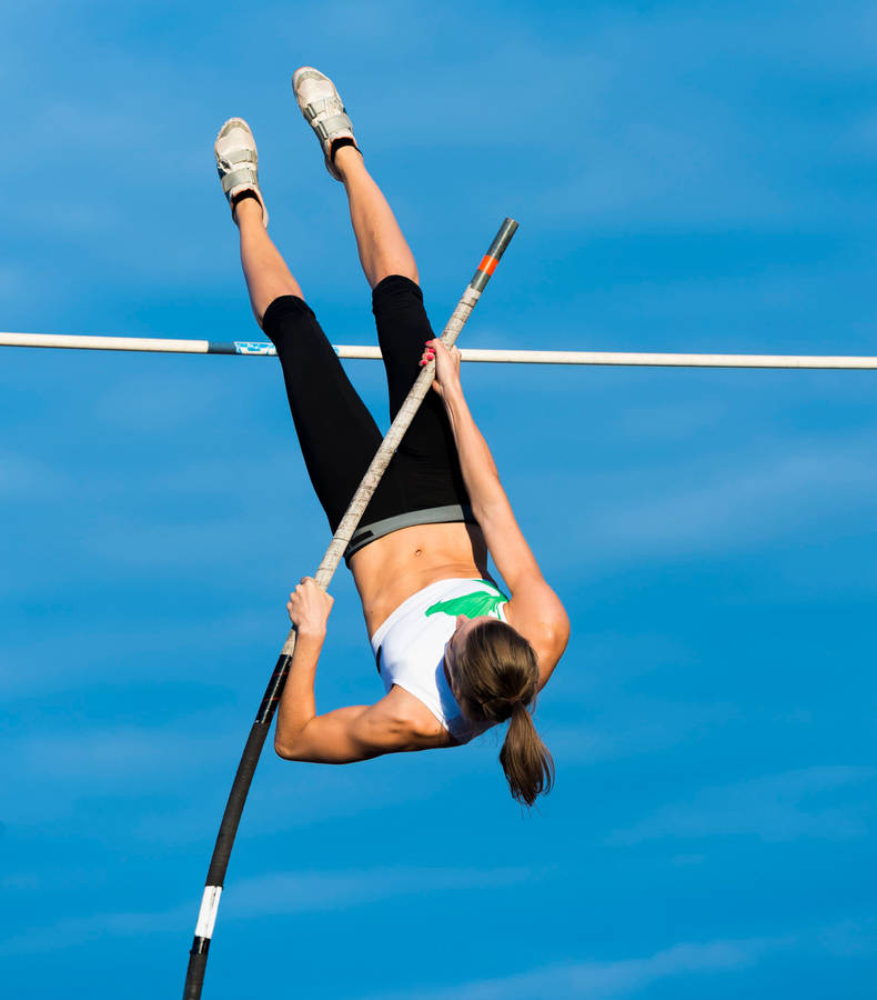 Impressive Female Pole Vault Athlete Wallpaper