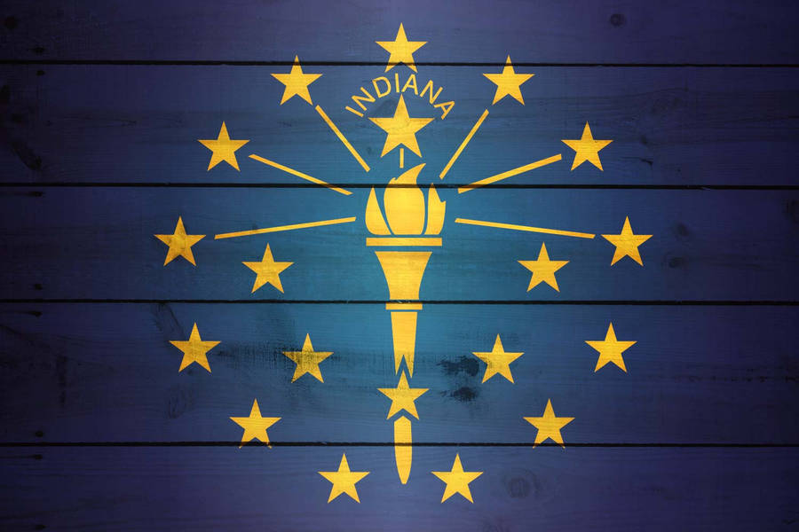 Indiana's State Torch On A Rustic Wooden Background Wallpaper