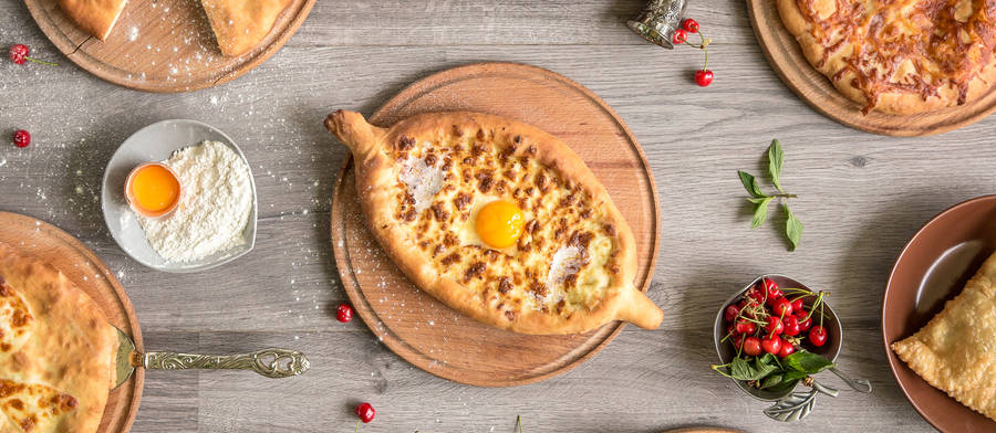 Indulge In A Piece Of Georgia With This Artistic Overhead Shot Of Khachapuri Wallpaper