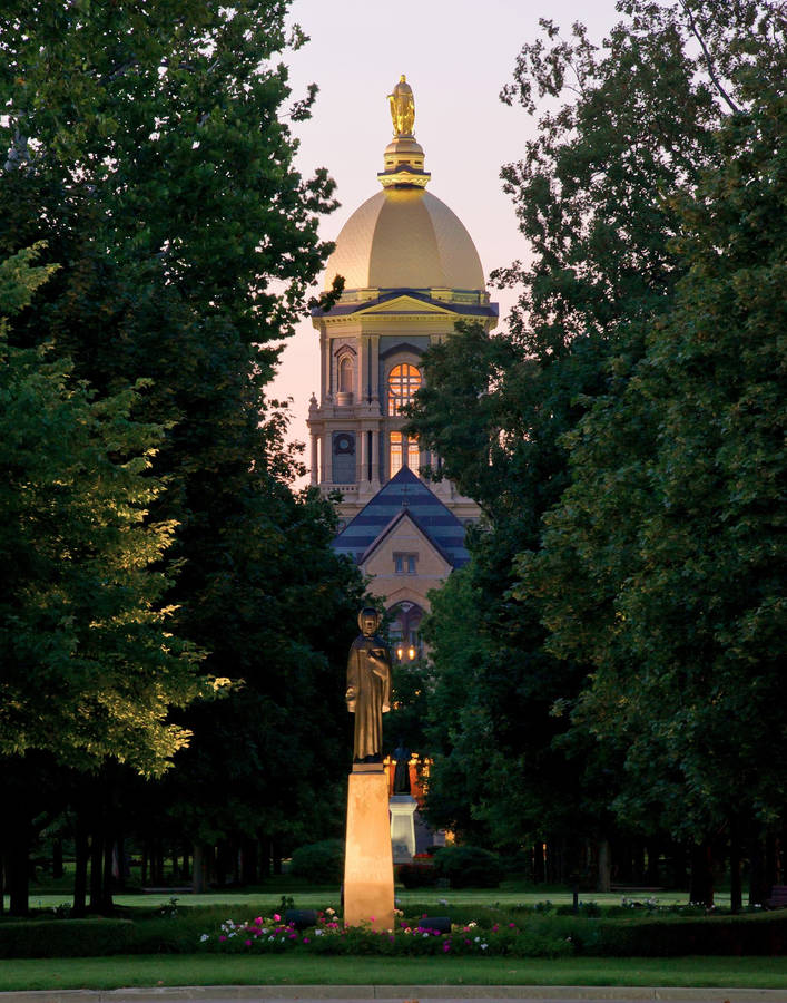 Inspiring Statue Under The Golden Dome At University Of Notre Dame. Wallpaper