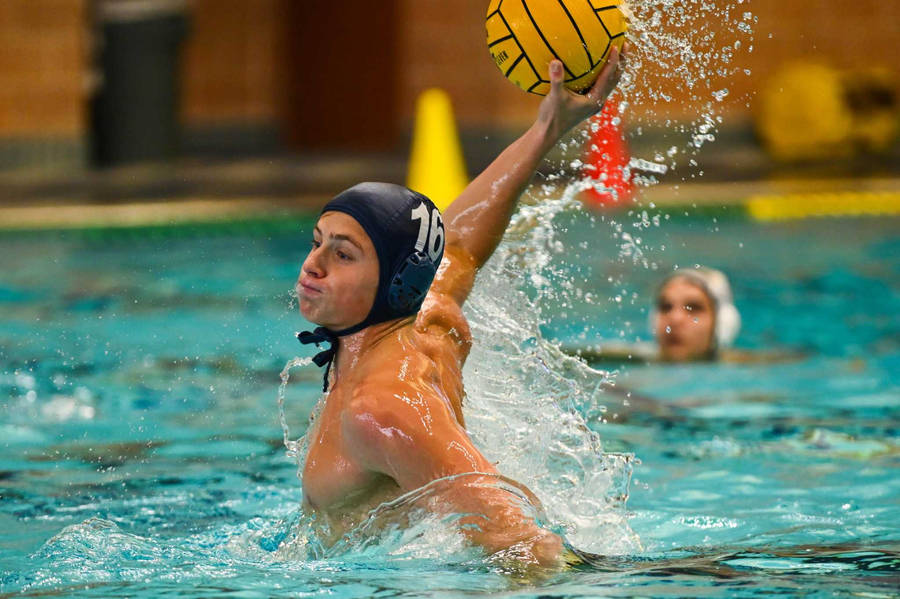 Intense Action At A Water Polo Game Wallpaper