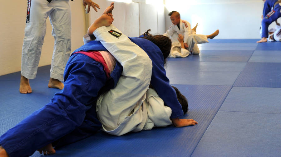 Intense Brazilian Jiu-jitsu Training Session Wallpaper