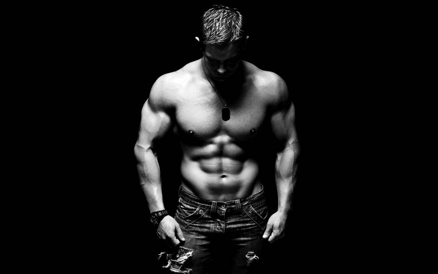 Intense Fitness Dedication - Black And White Portrait Of A Muscular Man Wallpaper