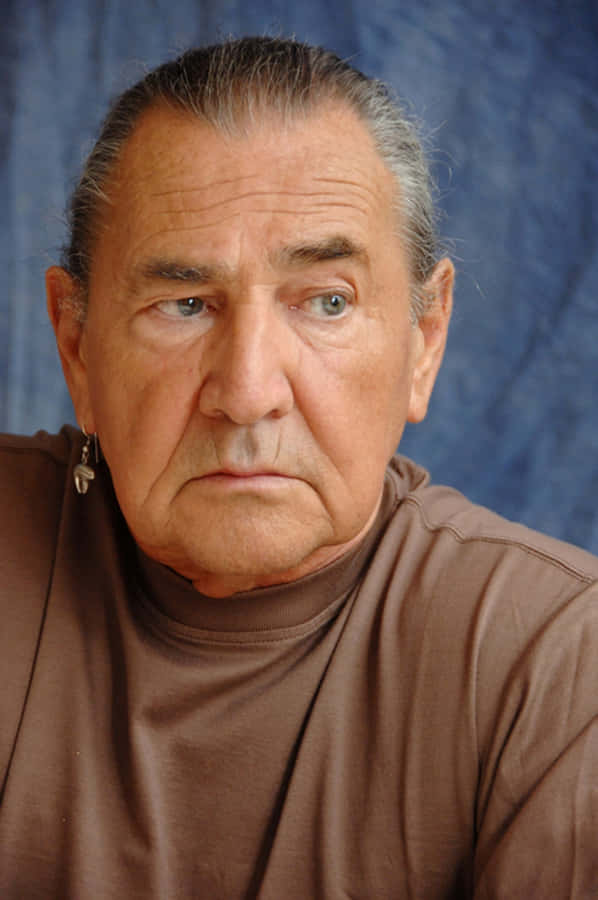 Intense Gaze Man Portrait Wallpaper
