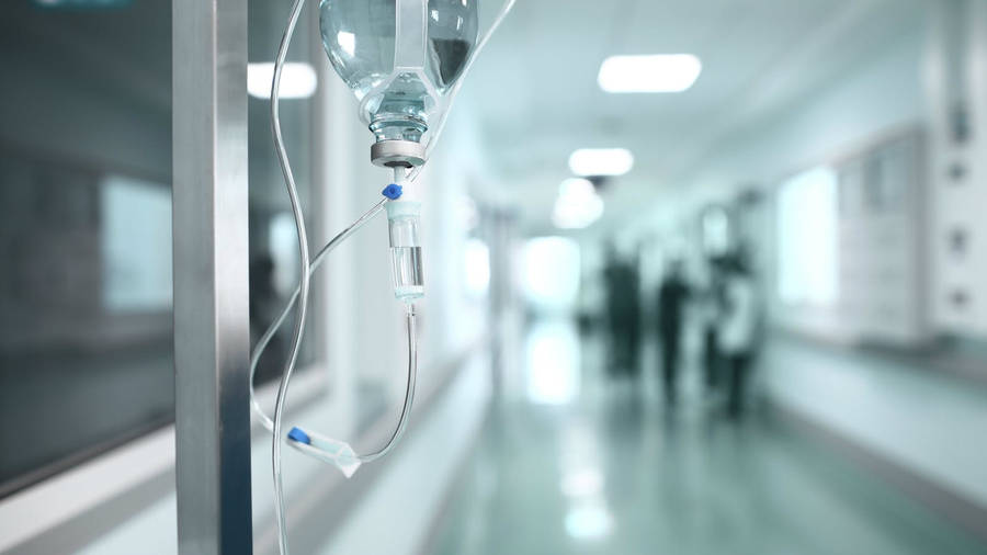 Intravenous Drip System In Hospital Hallway Wallpaper