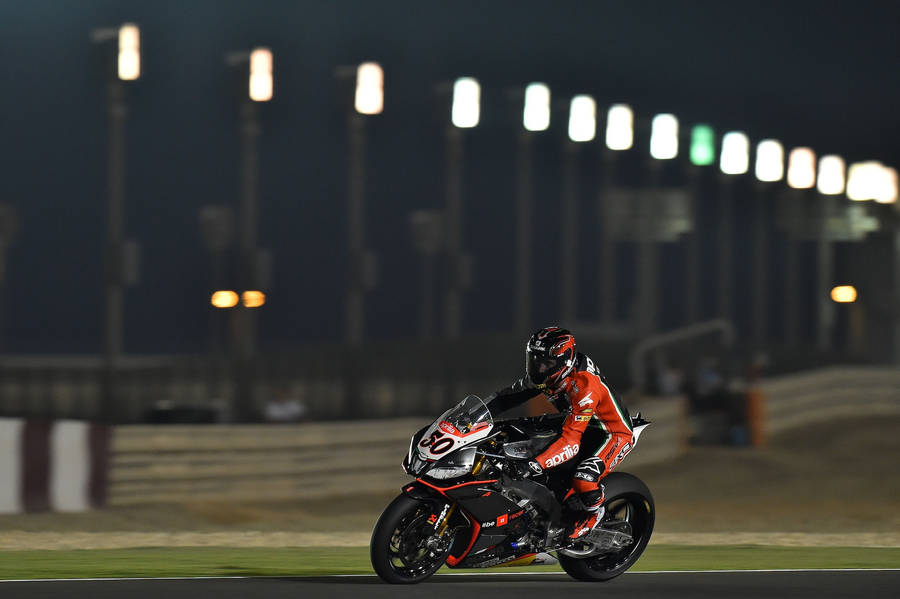 Intrepid Bike Rider Dominating The High-powered Motorcycle Race Wallpaper