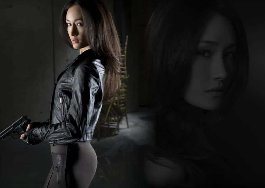 Intriguing Maggie Q Posing For A Photoshoot Wallpaper