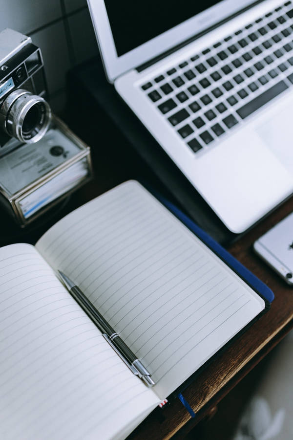 Iphone Desk With Journal And Pen Wallpaper