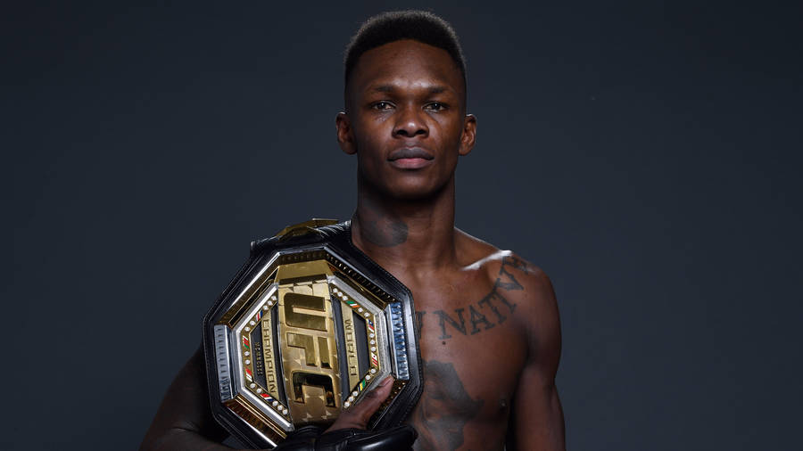 Israel Adesanya With Ufc Belt Wallpaper