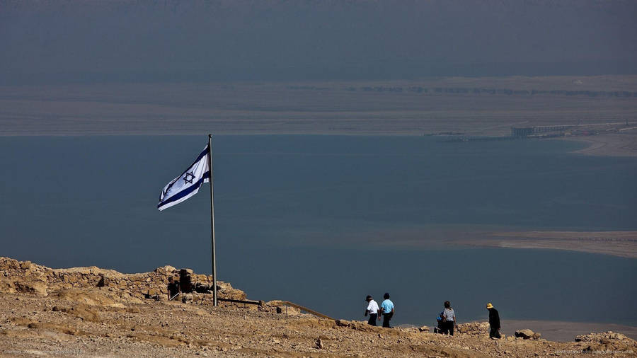 Israel Flag Fluttering By The Seaside Wallpaper