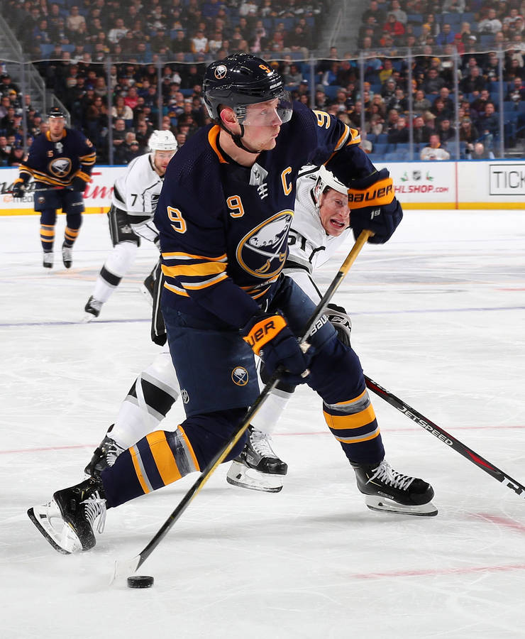 Jack Eichel Black Buffalo Uniform Attacking Wallpaper