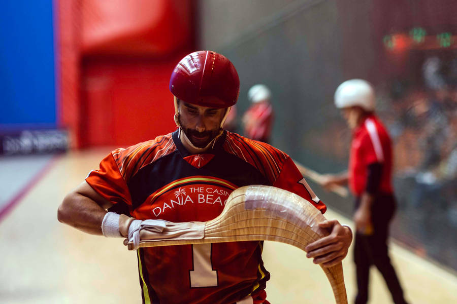 Jai Alai Player Adjusting His Cesta Wallpaper