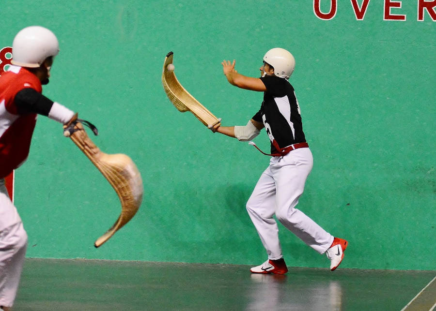 Jai Alai Players In Dynamic Game Action Wallpaper