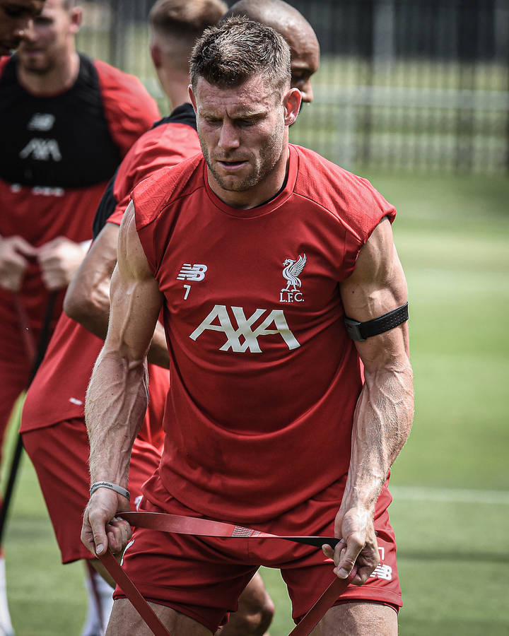 James Milner Engaged In Intense Football Training Session Wallpaper